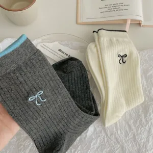 Korean style cute bow embroidered women socks detailed close up view comfortable knit stacking socks.