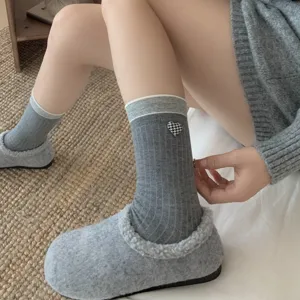 Grey cotton mid-tube socks for women featuring houndstooth heart pattern and cozy slip-ons.