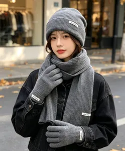 Women winter grey knit beanie scarf gloves three-piece set, cozy warm fashion accessories.