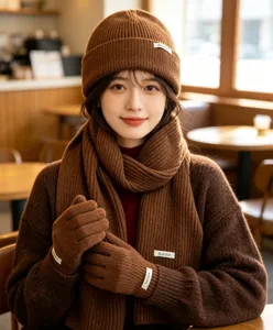 Cozy brown knit beanie scarf and gloves winter three-piece set for women warm apparel.