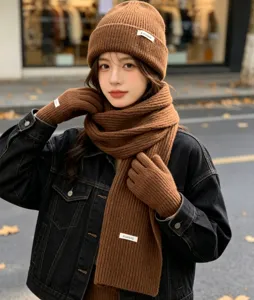 Brown knit beanie scarf and gloves set winter warm detail view stylish cozy outfit accessory.