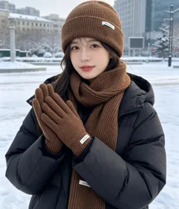 Winter brown knitted beanie scarf and gloves three-piece set, warm outdoor fashion apparel detail.