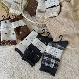 Songmu grey cashmere texture mulberry silk wool blended stacked socks with floral bows.