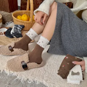 Cozy wool blend stack socks with floral lace trim and plush loafers lifestyle shot.