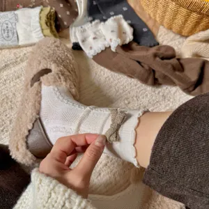 Women's winter warm ribbed knit ruffle socks with sweet bow detail for daily wear