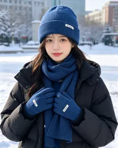 Winter knit hat scarf and gloves set in blue, warm winter accessories for women detail.