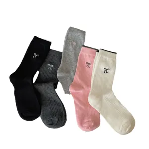 Korean style cute bow embroidered mid-tube socks set, various colors available for daily wear.