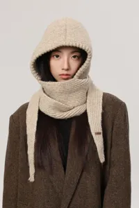 Close-up detail of the cozy knit balaclava hood and scarf combo, warm winter accessory.