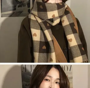 Detailed view of the cute brown and cream plaid scarf with heart pattern for women winter wear.