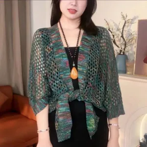 Detail shot of the green ice silk knit shrug, showcasing the open front hollow weave and texture.