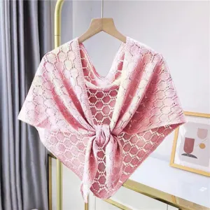Pink knitted hollow shawl for women, lightweight summer triangular scarf, elegant outfit accessory.