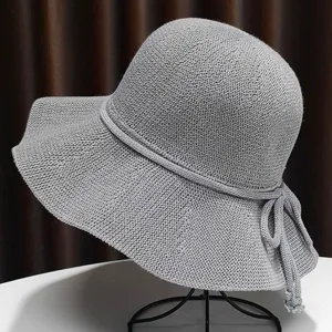 Detailed view of grey knit sun hat featuring fine woven texture and back bowknot.