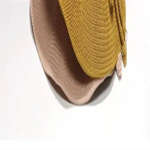 Detailed shot of breathable summer straw fisherman hat with fine woven texture and tassel.