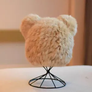 Close-up detail of the fluffy bear ear plush winter hat, showcasing soft warm texture.