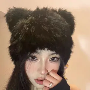 Detailed shot of thick plush bear ear winter hat, warm faux fur warm cap for cold days.