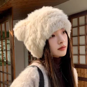 Fluffy faux fur winter ear protection hat with cute bear ears, warm and stylish for women.