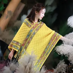 Yellow knit cape with fringe, comfortable warm shawl for outdoor vacation and travel.