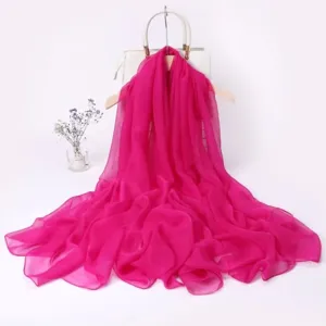 Long magenta chiffon scarf for women, elegant solid color fashion accessory for spring travel photos.