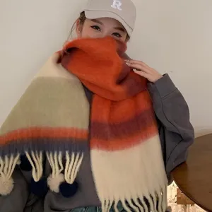 Colorful gradient mohair scarf with fluffy texture, playful tassels, and cozy warm winter wear.