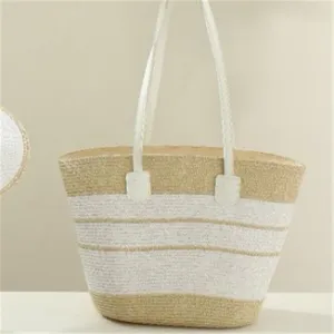 Woven straw tote bag with white stripes and handles, summer beach casual handbag detail shot.