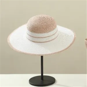 Elegant striped straw sun hat detail, stylish summer outdoor beach headwear for women.