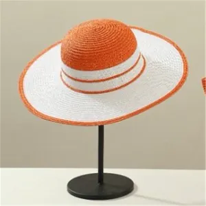Summer straw sun hat with stylish orange and white striped wide brim for outdoor travel.