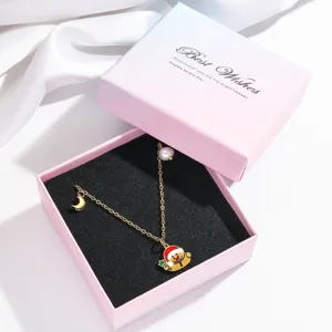 Collier de perles de Noël chic avec pendentif bonhomme de neige et lune pour jolies femmes.