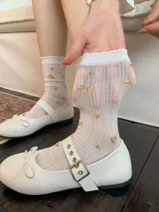 Calze a metà tubo in rete floreale giapponese, design traspirante con fiori gialli.