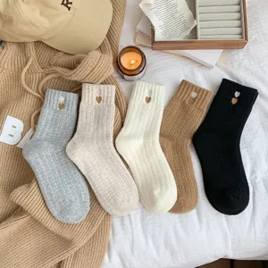 Thick winter women mid-tube socks with cute heart embroidery cozy thermal warm sleep socks detail.