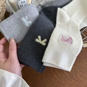 Cute embroidered bow cotton mid-calf socks for women, trendy sweet daily wear style.