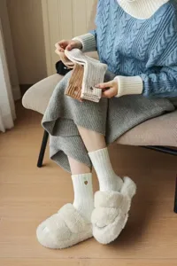 Close-up view of thick thermal women winter mid-calf socks featuring cute heart embroidery.