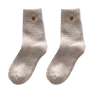 Women thick warm winter mid-tube socks with cute heart embroidery, comfortable knit design.