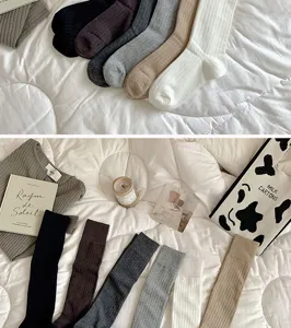 Solid color ribbed long socks for women, knee high casual socks for daily warm wear.