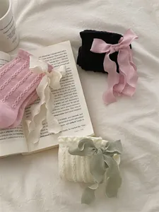 Sweet ribbon bow mid tube socks detail showcasing cute lolita style and soft fabric.