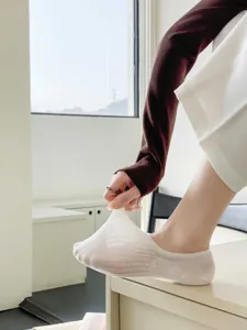 Detailed view showing the stretchable breathable mesh texture of the white summer boat sock.