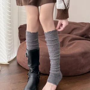 Detailed view of grey knit footless leg warmers, cozy winter ribbed boot socks for women.