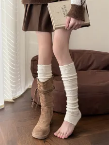 Detail shot of cozy cashmere footless leg warmers with hollow embossed knit pattern, cozy.