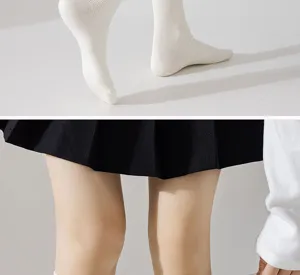 White ribbed knee-high socks detail view, comfortable cotton fabric for autumn and winter daily wear.