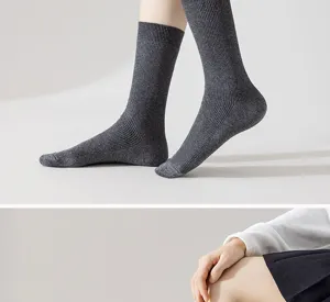Detailed close-up of women's dark grey ribbed mid-calf cotton socks for daily wear.