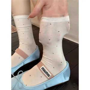 Sheer white polka dot mesh mid tube socks with cute ruffled trim for women summer wear main