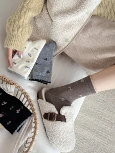 Cozy floral mid-tube cashmere socks for women, cute winter knit hosiery, stylish sweet style.