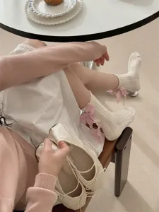Korean style women mid-tube socks with cute pink ribbon bow, perfect for sweet lolita outfits.