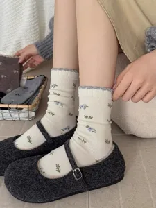 Cozy floral knit mid-tube socks detail shot, soft autumn winter daily wear fashion style.