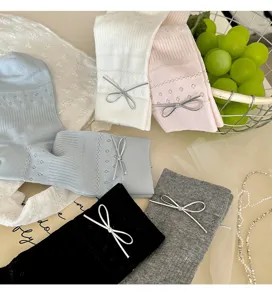 Korean style women mid-tube socks with mesh design and silver bowknot, sweet spring summer wear.