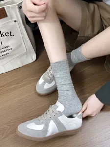 Grey cotton mid-tube socks for women, breathable solid color versatile slouch socks.