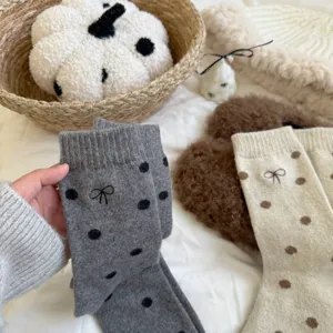 Women's warm wool socks detail, cute polka dot and bow embroidery, cozy winter slouch style.