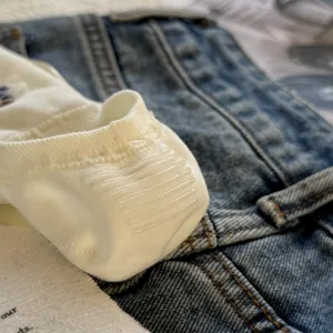 Close-up detail of women's solid color invisible socks, featuring heel silicone grip.