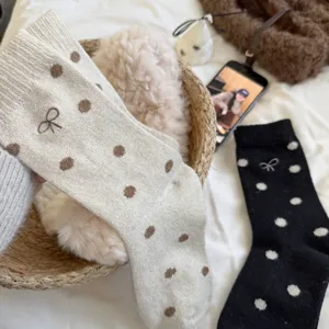 Cozy winter thick polka dot bow wool socks for women, soft warm mid-calf knit casual hosiery.
