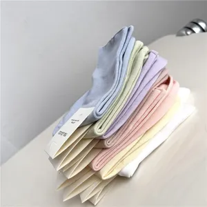 Pastel mid-calf cotton socks for women, soft solid color stacked socks, comfortable daily wear.