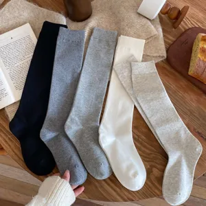 Solid color long tube socks for women, casual cotton knee high stockings, comfortable wear.